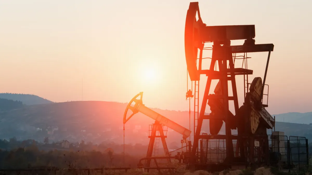 Pumpjacks at sunset in the Grande Prairie oilfield